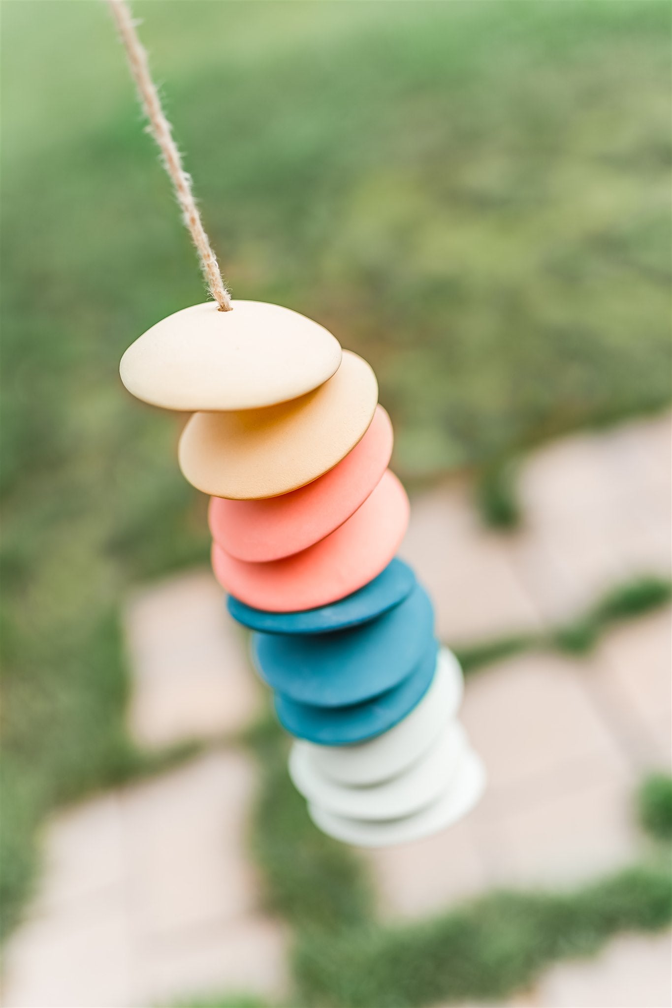 Ceramic chimes in light yellow, coral, teal, seafoam