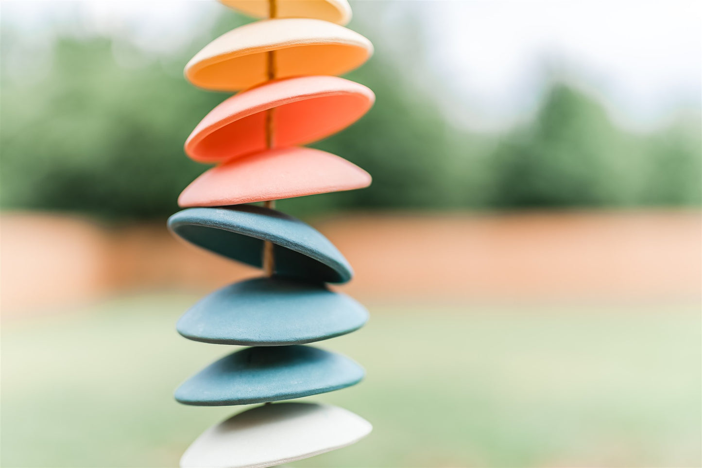 Ceramic chimes in light yellow, coral, teal, seafoam