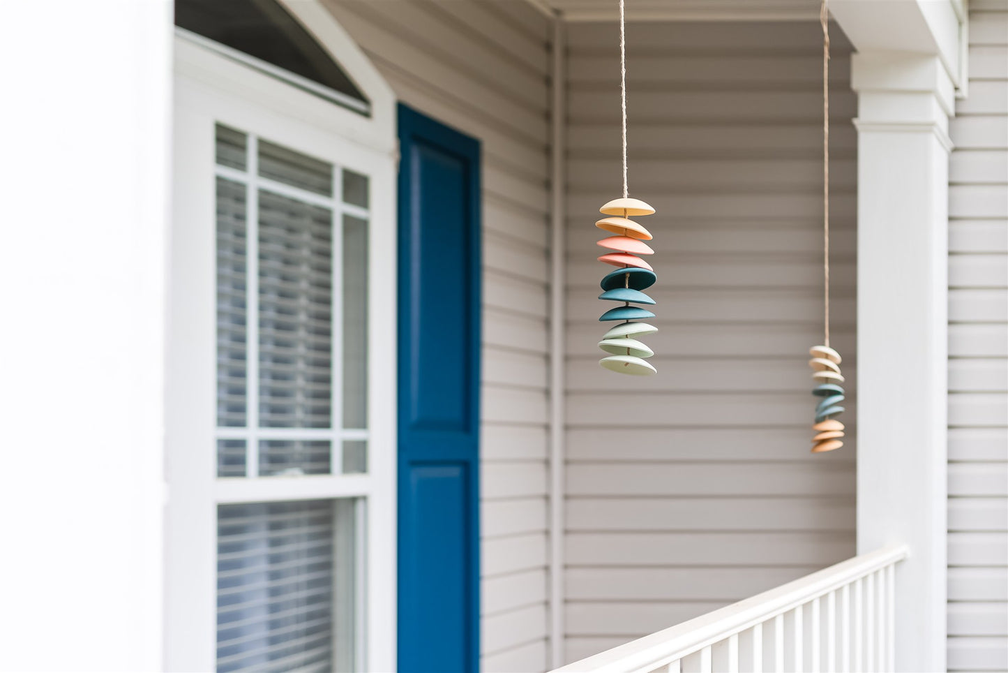 Ceramic chimes in light yellow, coral, teal, seafoam