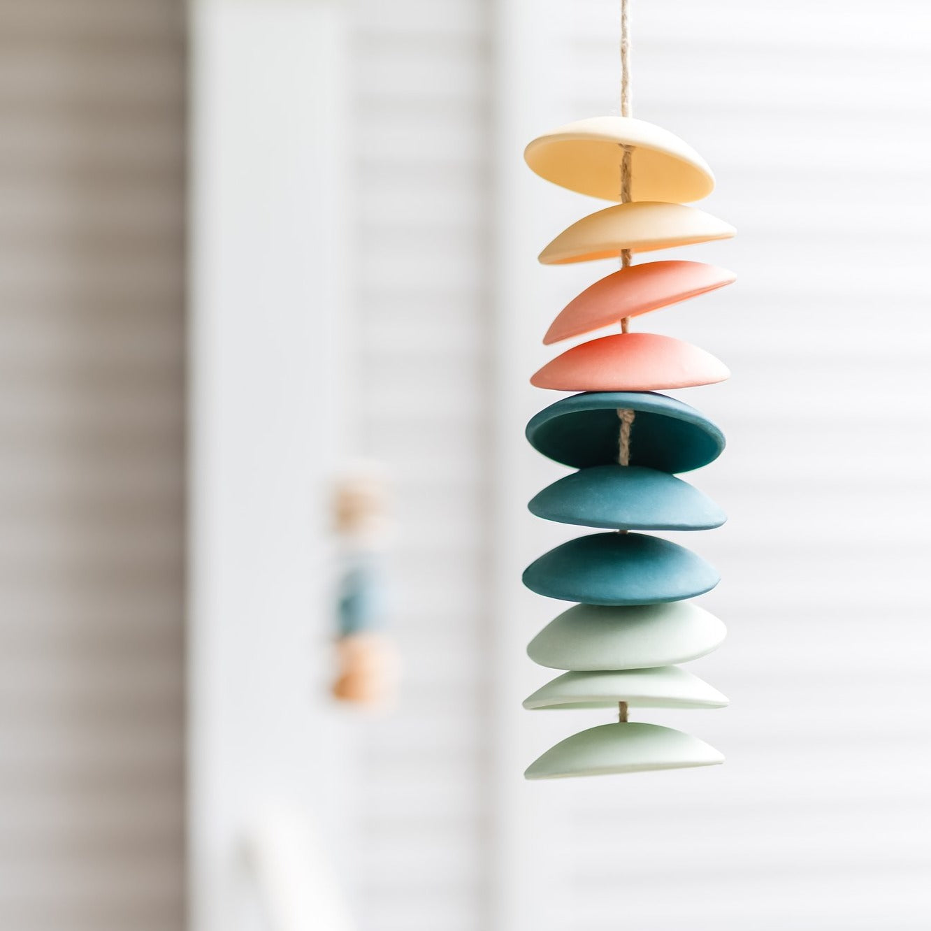 Ceramic chimes in light yellow, coral, teal, seafoam